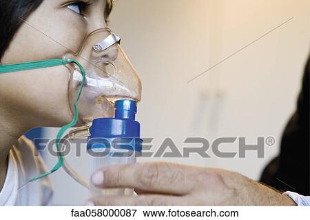 Boy receiving oxygen treatment View Large Photo Image Stock Photo - Boy receiving oxygen treatment. Fotosearch