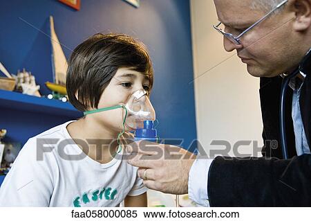 Boy receiving oxygen treatment View Large Photo Image Stock Photography - Boy receiving oxygen treatment. Fotosearch