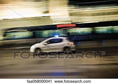 Car speeding down street at night View Large Photo Image Stock Image - Car speeding down street at night. Fotosearch