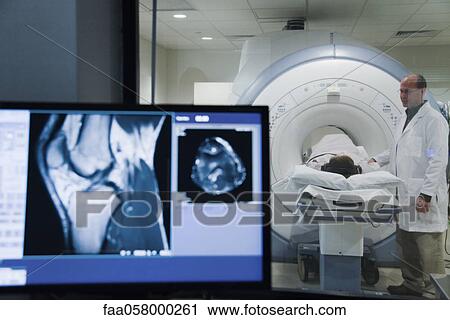 Doctor monitoring patient undergoing MRI scan View Large Photo Image Stock Image - Doctor monitoring patient undergoing MRI scan. Fotosearch