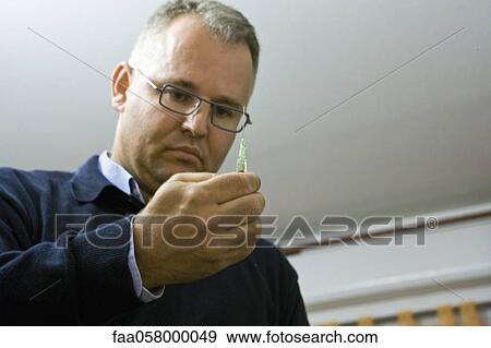 Doctor preparing injection View Large Photo Image Stock Photo - Doctor preparing injection. Fotosearch