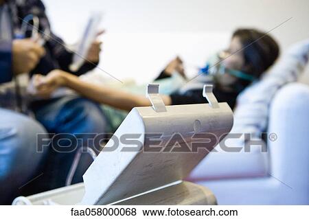 Doctor treating patient in home View Large Photo Image Stock Photo - Doctor treating patient in home. Fotosearch
