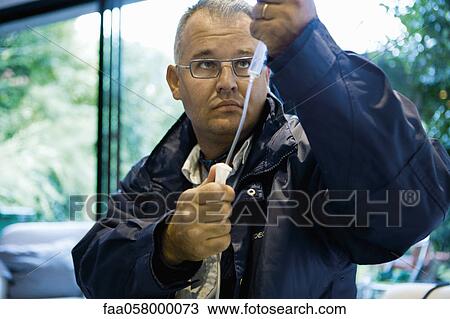 Emergency doctor preparing IV drip View Large Photo Image Stock Image - Emergency doctor preparing IV drip. Fotosearch