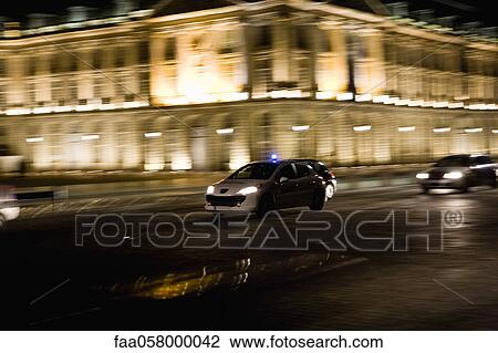 Emergency medical car driving at night View Large Photo Image Stock Image - Emergency medical car driving at night. Fotosearch