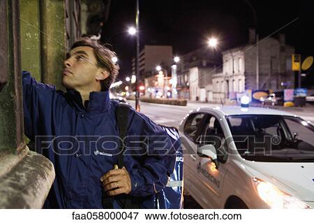 Emergency on-call doctor making a house call at night View Large Photo Image Stock Photo - Emergency on-call doctor making a house call at night. Fotosearch