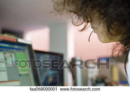 Stock Image - Emergency services dispatcher. Fotosearch