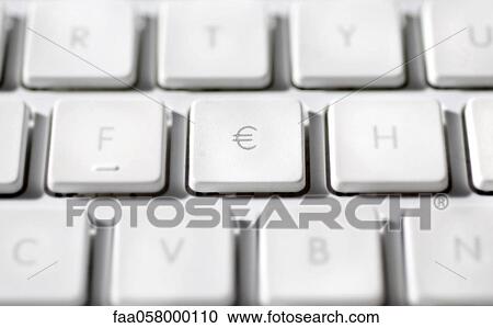 Stock Image - Euro sign on laptop computer keyboard. Fotosearch