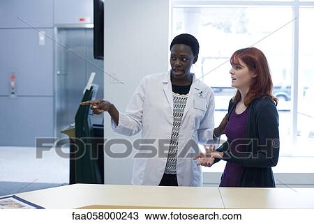 Female healthcare worker directing patient View Large Photo Image Stock Image - Female healthcare worker directing patient. Fotosearch