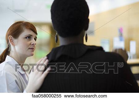 Female healthcare worker putting hand on patient's shoulder View Large Photo Image Stock Photography - Female healthcare worker putting hand on patient's shoulder. Fotosearch