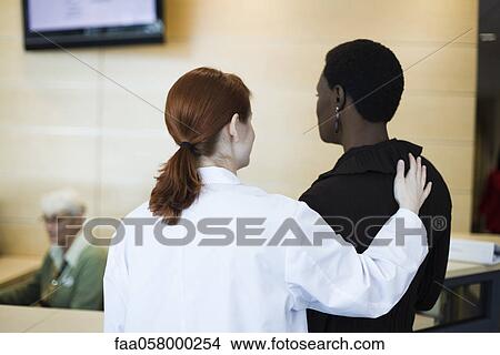 Female healthcare worker reassuring patient View Large Photo Image Picture - Female healthcare worker reassuring patient. Fotosearch
