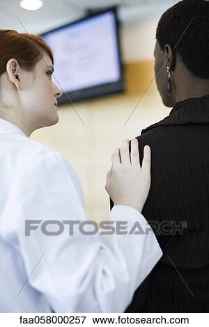 Female healthcare worker showing concern for patient View Large Photo Image Stock Photo - Female healthcare worker showing concern for patient. Fotosearch