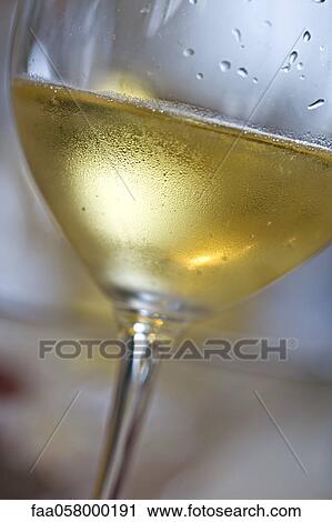 Glass of chilled white wine View Large Photo Image Stock Image - Glass of chilled white wine. Fotosearch