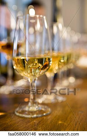 Glasses of white wine View Large Photo Image Stock Photograph - Glasses of white wine. Fotosearch