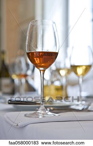Glasses of wine on table View Large Photo Image Stock Image - Glasses of wine on table. Fotosearch