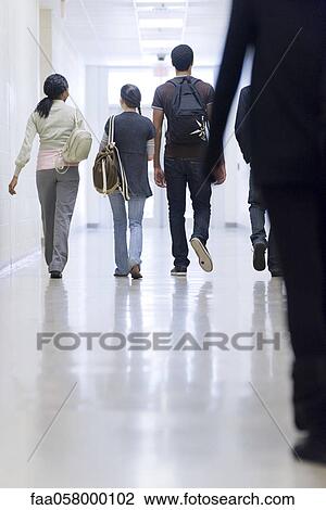 High school students walking down school corridor, rear view View Large Photo Image Stock Image - High school students walking down school corridor, rear view. Fotosearch