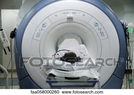 Patient undergoing MRI scan View Large Photo Image Stock Image - Patient undergoing MRI scan. Fotosearch