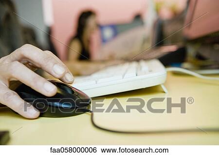 Person using computer mouse, cropped View Large Photo Image Stock Photograph - Person using computer mouse, cropped. Fotosearch