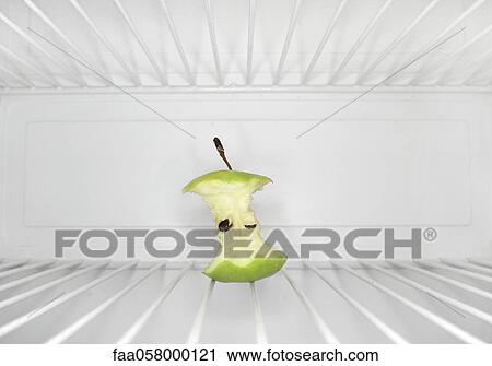Single apple core sitting on shelf inside refrigerator View Large Photo Image Stock Image - Single apple core sitting on shelf inside refrigerator. Fotosearch