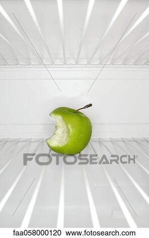 Single apple with bite mark sitting on shelf inside refrigerator View Large Photo Image Stock Image - Single apple with bite mark sitting on shelf inside refrigerator. Fotosearch