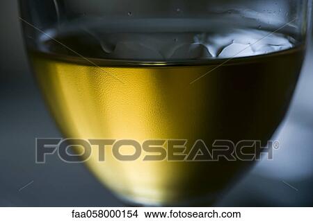 Tears of wine on chilled glass of white wine View Large Photo Image Picture - Tears of wine on chilled glass of white wine. Fotosearch