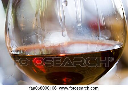 Tears of wine on glass of red wine View Large Photo Image Stock Photograph - Tears of wine on glass of red wine. Fotosearch