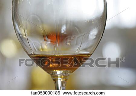 Tears of wine on glass of rose wine View Large Photo Image Stock Photograph - Tears of wine on glass of rose wine. Fotosearch
