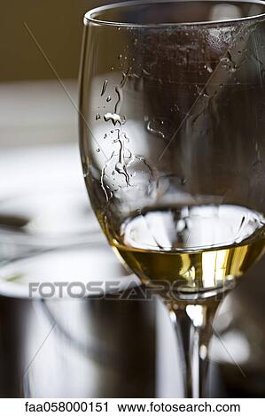 Tears of wine on glass of white wine View Large Photo Image Stock Image - Tears of wine on glass of white wine. Fotosearch