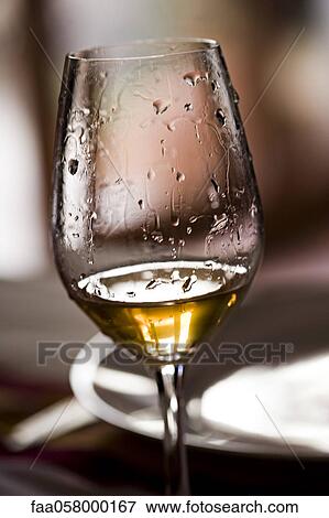 Tears of wine on glass of white wine View Large Photo Image Stock Photo - Tears of wine on glass of white wine. Fotosearch