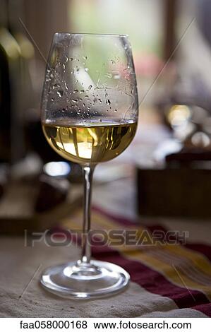 Tears of wine on glass of white wine View Large Photo Image Stock Photo - Tears of wine on glass of white wine. Fotosearch