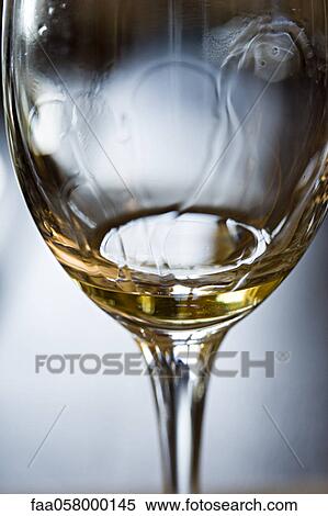 Tears of wine on glass of white wine View Large Photo Image Stock Photography - Tears of wine on glass of white wine. Fotosearch