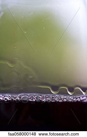 Tears of wine, tiny bubbles on glass of red wine View Large Photo Image Stock Photo - Tears of wine, tiny bubbles on glass of red wine. Fotosearch