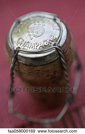 Wire cage with cap on champagne cork, close-up View Large Photo Image Stock Photo - Wire cage with cap on champagne cork, close-up. Fotosearch