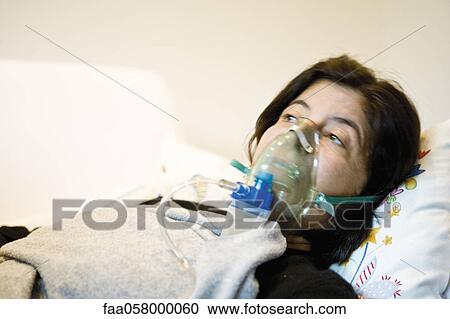 Woman receiving oxygen treatment View Large Photo Image Stock Image - Woman receiving oxygen treatment. Fotosearch