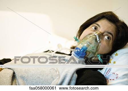 Woman receiving oxygen treatment View Large Photo Image Stock Image - Woman receiving oxygen treatment. Fotosearch