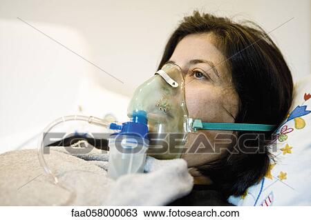 Woman receiving oxygen treatment View Large Photo Image Stock Image - Woman receiving oxygen treatment. Fotosearch