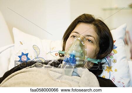 Woman receiving oxygen treatment View Large Photo Image Stock Photograph - Woman receiving oxygen treatment. Fotosearch