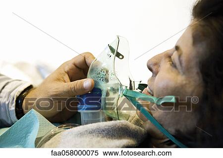 Woman receiving oxygen treatment View Large Photo Image Stock Photography - Woman receiving oxygen treatment. Fotosearch