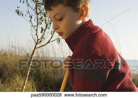 Stock Photo - Boy exploring outdoors. Fotosearch