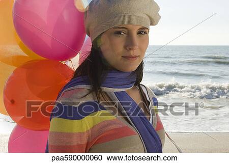 Preteen girl with bunch of balloons at beach View Large Photo Image Stock Image - Preteen girl with bunch of balloons at beach. Fotosearch