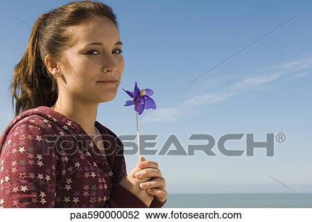 Preteen girl with pinwheel, portrait View Large Photo Image Stock Image - Preteen girl with pinwheel, portrait. Fotosearch