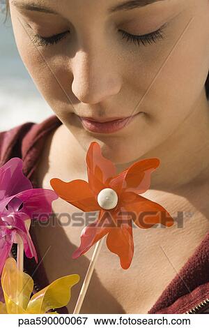 Preteen girl with pinwheels, portrait View Large Photo Image Stock Photo - Preteen girl with pinwheels, portrait. Fotosearch