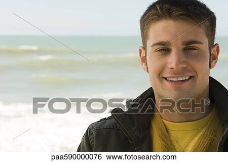 Stock Photograph - Young man, portrait. Fotosearch