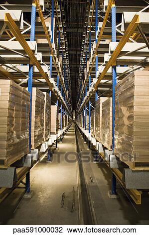 Automated Storage and Retrieval System, AS/RS, operating in the dark to conserve energy in warehouse View Large Photo Image Stock Image - Automated Storage and Retrieval System, AS/RS, operating in the dark to conserve energy in warehouse. Fotosearch