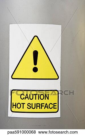 Caution sign announcing hot surface View Large Photo Image Stock Photo - Caution sign announcing hot surface. Fotosearch
