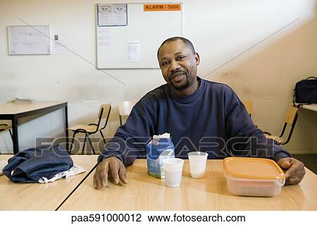 Factory worker having lunch in breakroom View Large Photo Image Stock Image - Factory worker having lunch in breakroom. Fotosearch