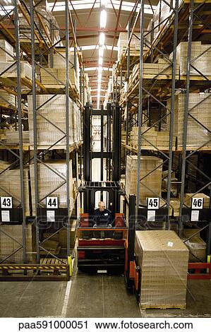 Forklift moving pallets in warehouse View Large Photo Image Stock Image - Forklift moving pallets in warehouse. Fotosearch