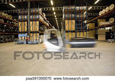 Forklift transporting roll in carpet tile factory warehouse View Large Photo Image Stock Image - Forklift transporting roll in carpet tile factory warehouse. Fotosearch