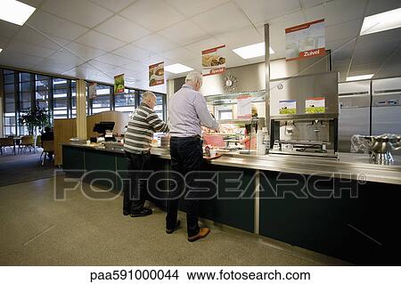 Men getting lunch in cafeteria View Large Photo Image Picture - Men getting lunch in cafeteria. Fotosearch