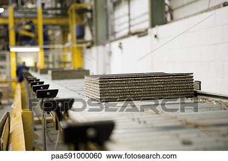 Piled carpet tiles on an automatic roller conveyor with detection cells designed for energy conservation View Large Photo Image Stock Image - Piled carpet tiles on an automatic roller conveyor with detection cells designed for energy conservation. Fotosearch