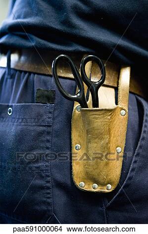 Scissors in pouch on tool belt View Large Photo Image Picture - Scissors in pouch on tool belt. Fotosearch